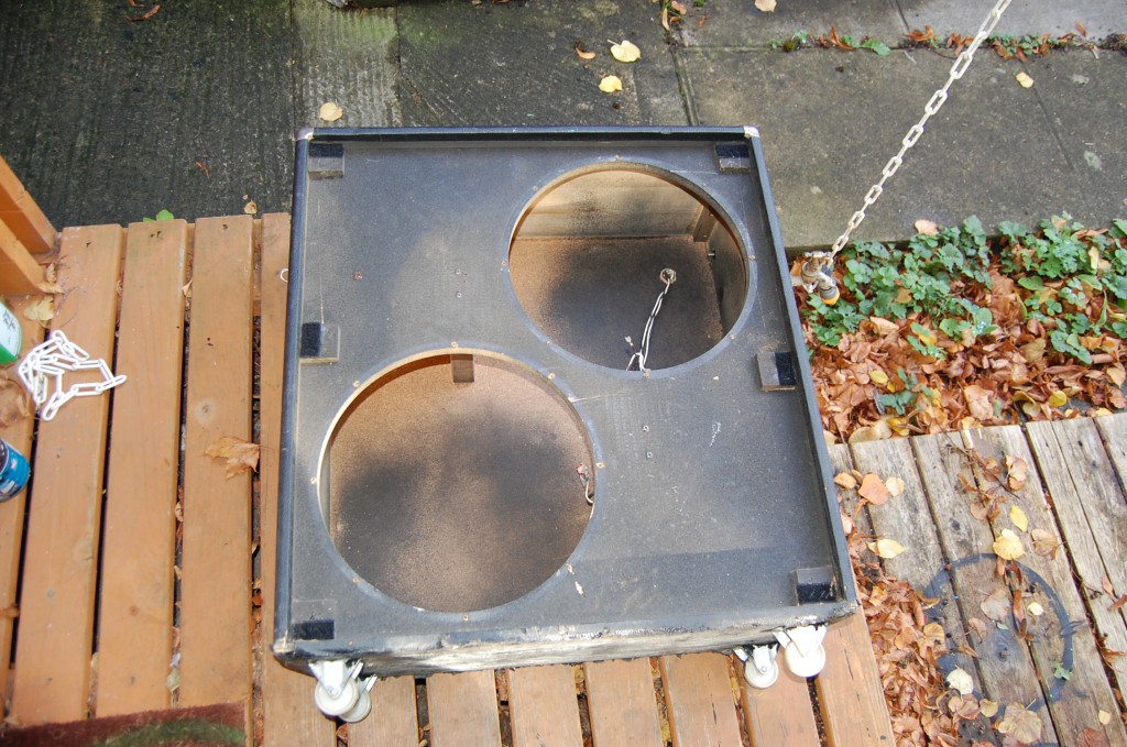 Pine casing, chipboard baffle on front and chipboard back