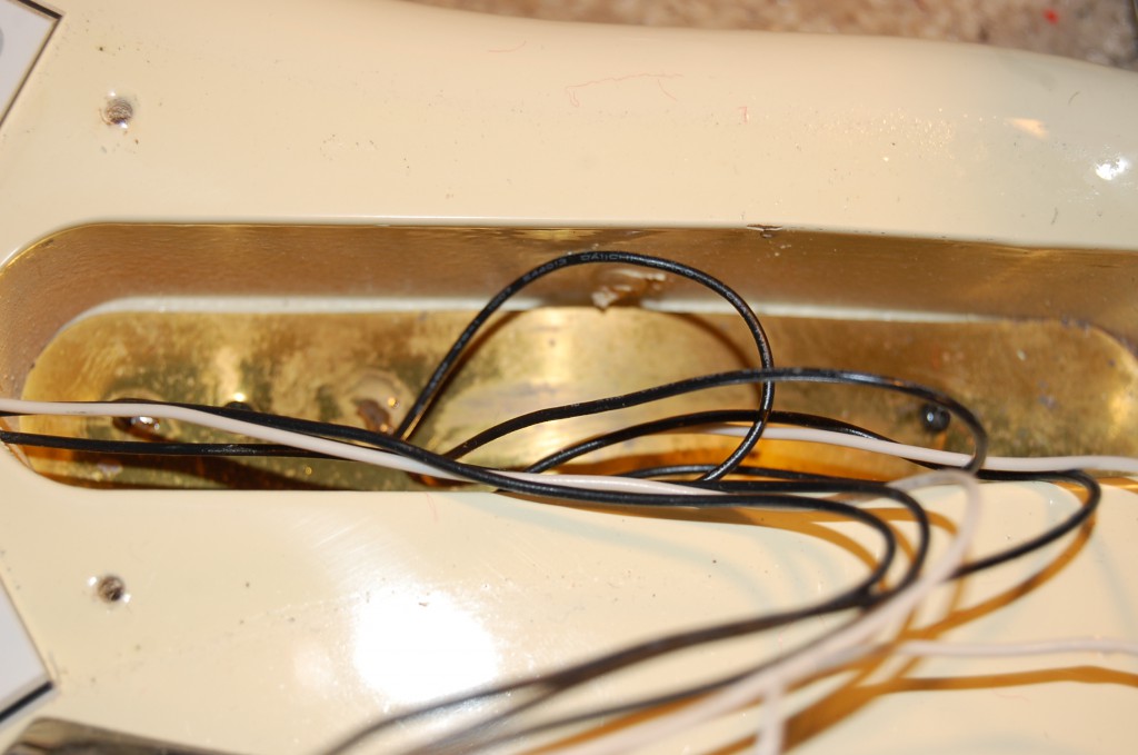 Brass plate at the bottom of the swich cavity, mark of a well made guitar